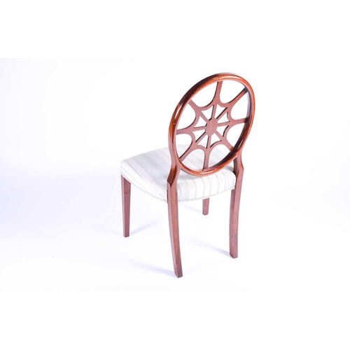 117 - A Georgian style wheel back dining chair with satinwood veneer, the overstuffed seat on plain taperi... 