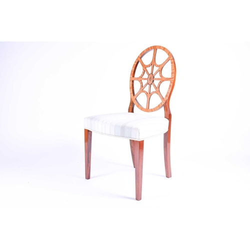 117 - A Georgian style wheel back dining chair with satinwood veneer, the overstuffed seat on plain taperi... 