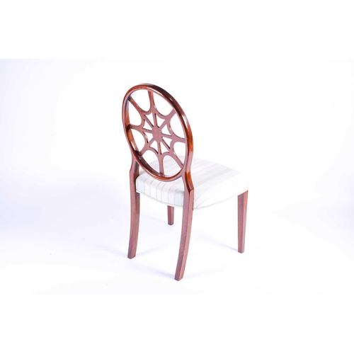 117 - A Georgian style wheel back dining chair with satinwood veneer, the overstuffed seat on plain taperi... 