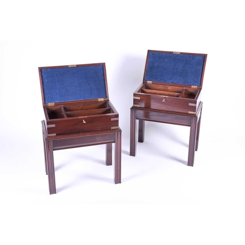 122 - A pair of 20th century campaign style boxes on stands, with brass mounts and lift compartmentalised ... 