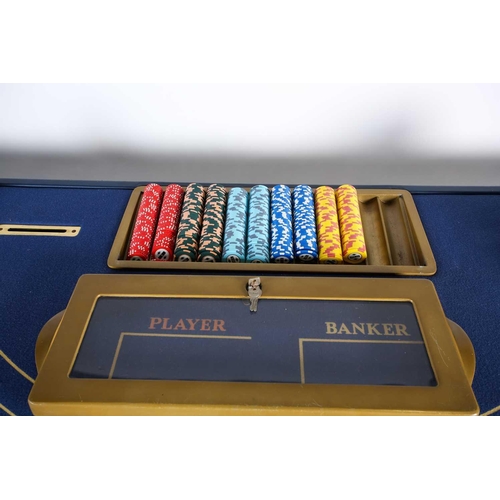 125 - An original Ritz (London) croupier’s baccarat card table, with gaming chips and related items, manua... 