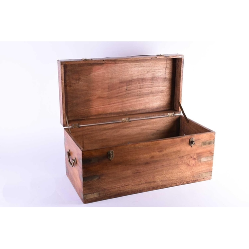 126 - A small campaign style reproduction teak chest, with brass bindings, locking clasps and carrying han... 