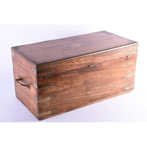 126 - A small campaign style reproduction teak chest, with brass bindings, locking clasps and carrying han... 