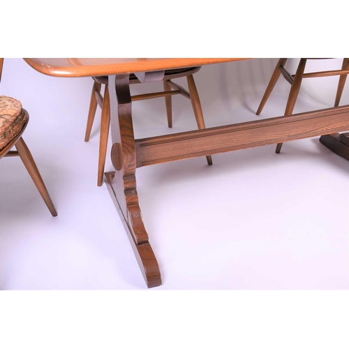 127 - Lucian Ercolani for Ercol, a mid-20th century beech dining room suite, comprising a refectory style ... 