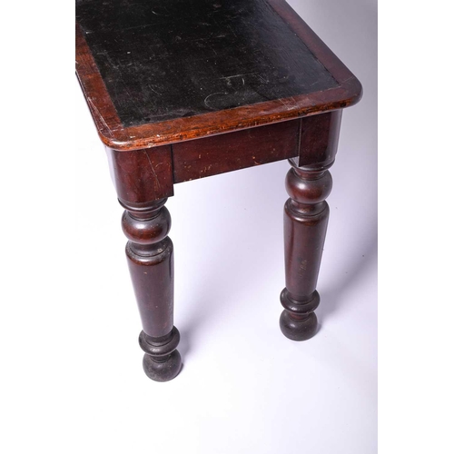 131 - A Victorian mahogany side table, the rectangular top with rounded corners and leather writing surfac... 