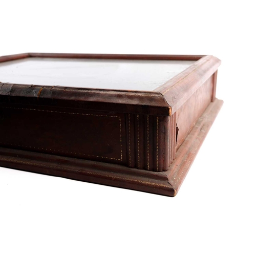 138 - A 19th-century tabletop bijouterie display case, leather-bound with lock, together with a wall-mount... 