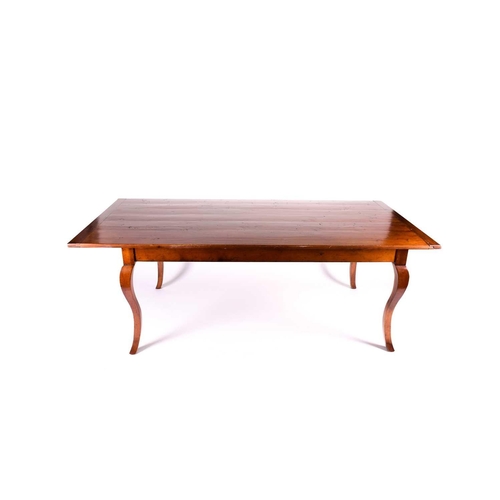 139 - A large French cherrywood dining table, the rectangular top with cleated ends, supported on french c... 