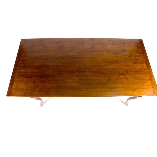 139 - A large French cherrywood dining table, the rectangular top with cleated ends, supported on french c... 