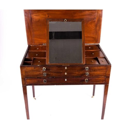 140 - Georgian mahogany gentleman's dressing table, the hinged top opening to reveal an adjustable ratchet... 