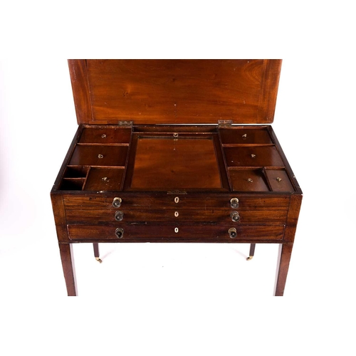 140 - Georgian mahogany gentleman's dressing table, the hinged top opening to reveal an adjustable ratchet... 