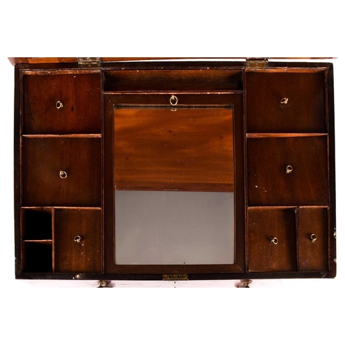 140 - Georgian mahogany gentleman's dressing table, the hinged top opening to reveal an adjustable ratchet... 