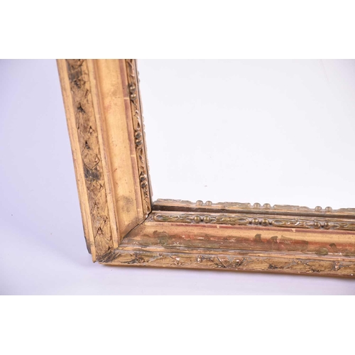 147 - A 19th century carved giltwood wall mirror, with leaf and berry decoration to the border, 114 cm x 9... 