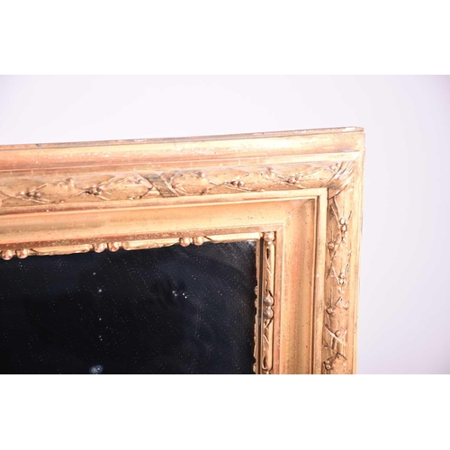 147 - A 19th century carved giltwood wall mirror, with leaf and berry decoration to the border, 114 cm x 9... 