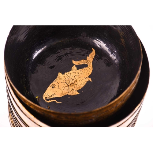 155 - A collection of Chinese black lacquered bowls, with extensive gilt decoration and animals to the int... 