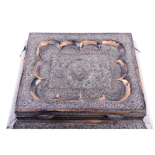 156 - A large Persian brass casket, early 20th century, with copper, white metal and niello decoration, th... 