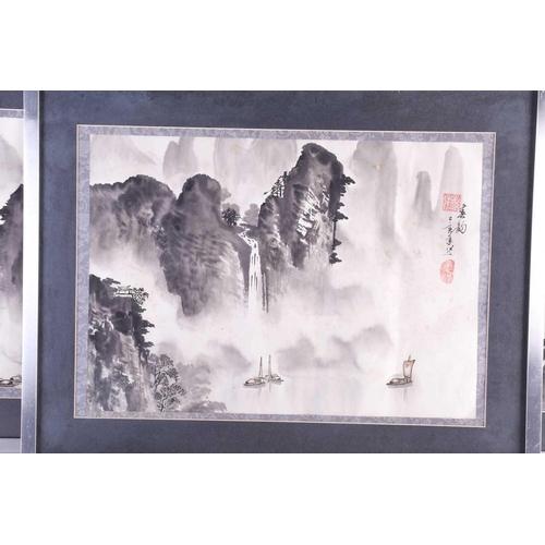 169 - Three Chinese prints of misty mountain and river scapes with wash detail. Bearing red studio marks i... 