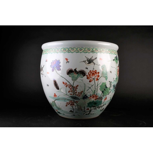 179 - A Chinese porcelain fishbowl, 19th/20th century, painted with a watery landscape with blossoming lot... 