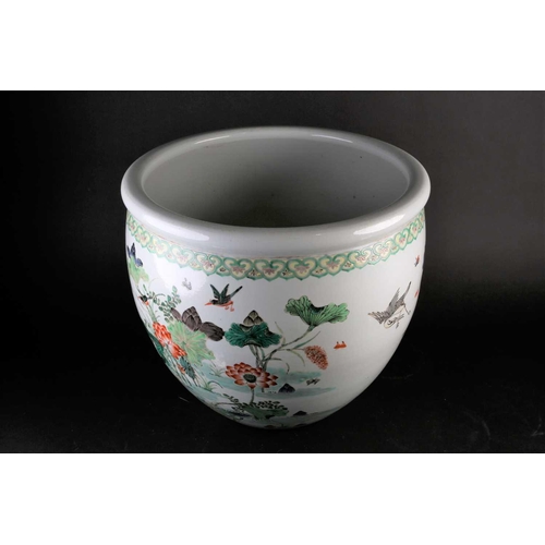 179 - A Chinese porcelain fishbowl, 19th/20th century, painted with a watery landscape with blossoming lot... 