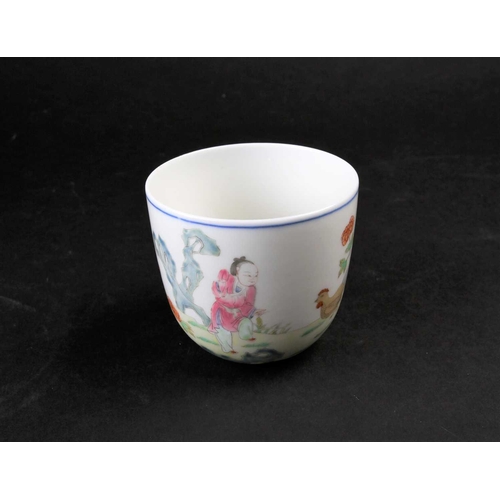 183 - A Chinese porcelain 'Chicken' wine cup, painted with a figure holding corn with chickens and chicks ... 