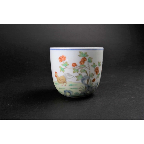 183 - A Chinese porcelain 'Chicken' wine cup, painted with a figure holding corn with chickens and chicks ... 