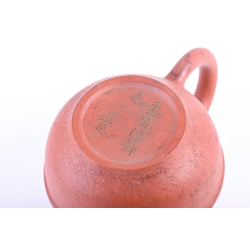 185 - A small Chinese Yixing teapot, the body with a raised band, incised Meng Chen and further marks to t... 