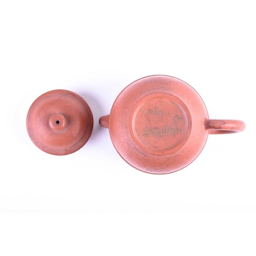 185 - A small Chinese Yixing teapot, the body with a raised band, incised Meng Chen and further marks to t... 