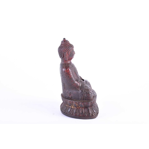 196 - A Chinese bronze buddha, seated in Dyhana mudra, traces of red pigment and gilt throughout, on doubl... 