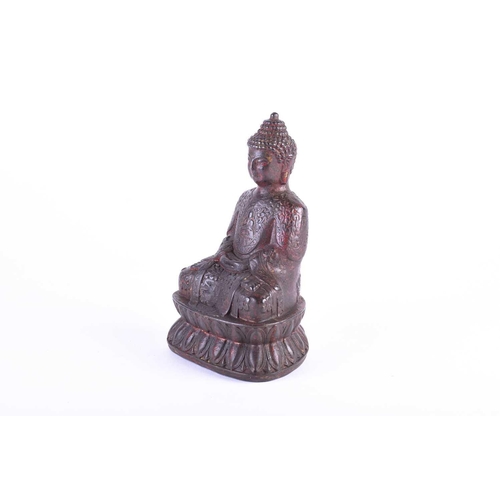 196 - A Chinese bronze buddha, seated in Dyhana mudra, traces of red pigment and gilt throughout, on doubl... 