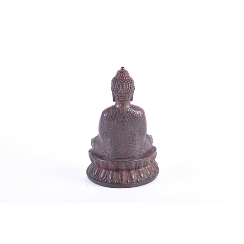 196 - A Chinese bronze buddha, seated in Dyhana mudra, traces of red pigment and gilt throughout, on doubl... 