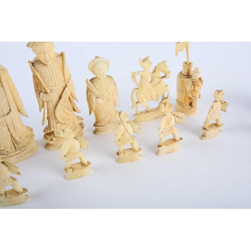 202 - A Chinese natural and red stained ivory chess set, late 19th/early 20th century, the red king 11cm, ... 