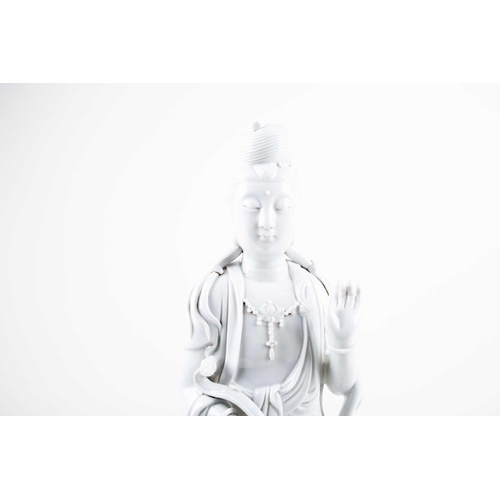 222 - A large Chinese blanc de Chine figure of Guanyin, 20th century, modelled seated in lalitasana, dress... 