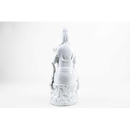 222 - A large Chinese blanc de Chine figure of Guanyin, 20th century, modelled seated in lalitasana, dress... 