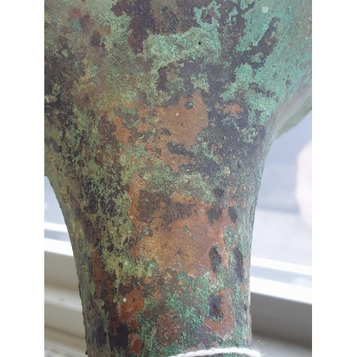 224 - A Chinese cast bronze Gu form ritual wine vessel, Shang Dynasty, with flaring rim above the tapering... 