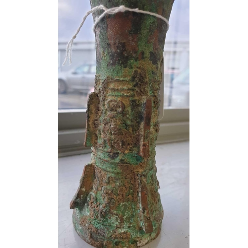 224 - A Chinese cast bronze Gu form ritual wine vessel, Shang Dynasty, with flaring rim above the tapering... 