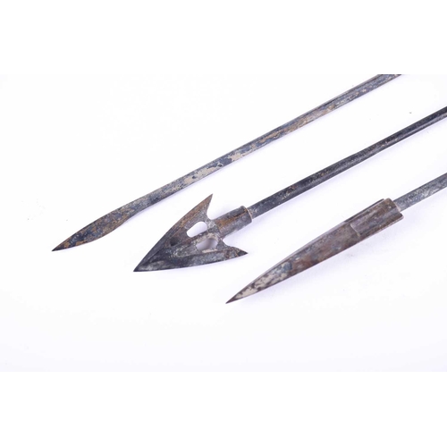 225 - Three Chinese bronze cross bow bolts, Warring States, each upon a long plain shaft, 27.5cm, 29cm & 3... 