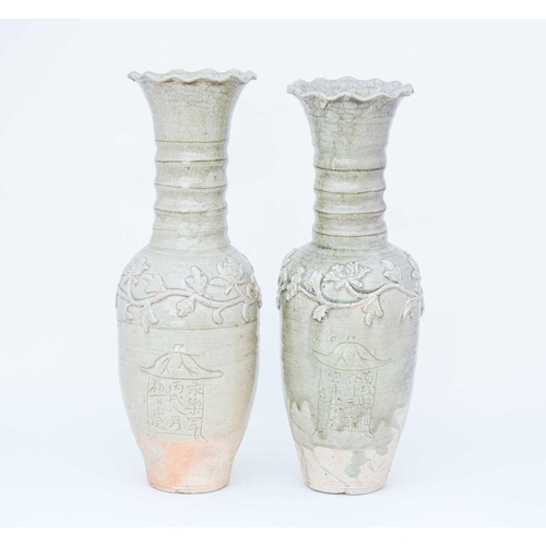 232 - Two Chinese celadon funerary vases, one dated 1404, each with elongated ovoid body, engraved with a ... 