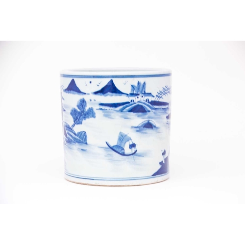 243 - A large Chinese blue & white brush pot, Bitong, painted throughout with a watery landscape of buildi... 