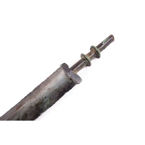 245 - A Chinese short sword, Warring States period, the grip with two disc knops, the blade with flat medi... 