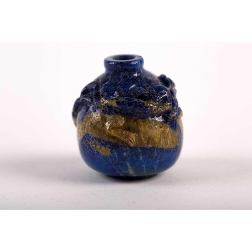 262 - A Chinese carved lapis lazuli snuff bottle, 19th/20th century, carved as a miniature vase, a chilong... 