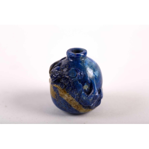 262 - A Chinese carved lapis lazuli snuff bottle, 19th/20th century, carved as a miniature vase, a chilong... 