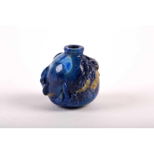 262 - A Chinese carved lapis lazuli snuff bottle, 19th/20th century, carved as a miniature vase, a chilong... 