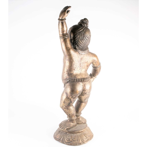 266 - A large Indian bronze figure of Krishna, 19th/20th century, modelled in dancing pose, wearing bells ... 