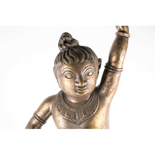 266 - A large Indian bronze figure of Krishna, 19th/20th century, modelled in dancing pose, wearing bells ... 