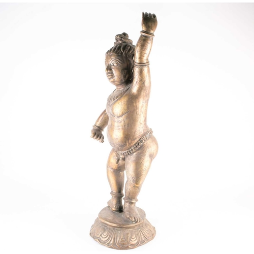 266 - A large Indian bronze figure of Krishna, 19th/20th century, modelled in dancing pose, wearing bells ... 