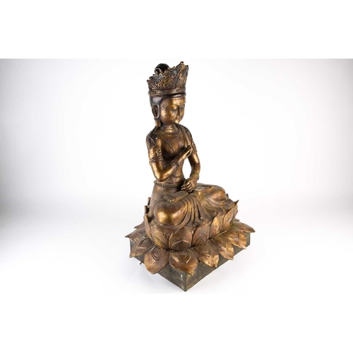 268 - A Chinese bronze figure of Avalokitesvara, 20th century, seated in mudra pose on a double lotus thro... 