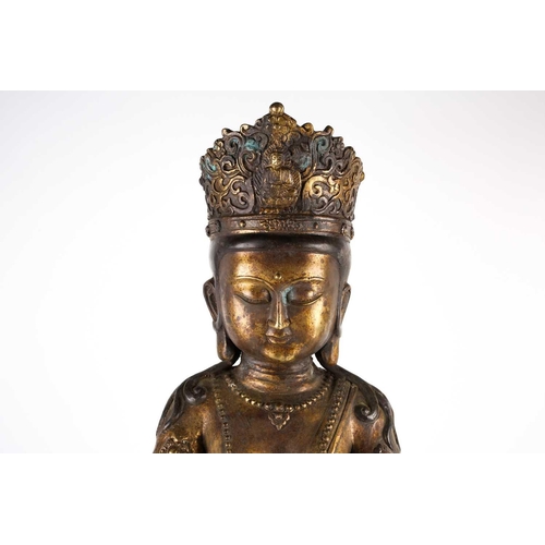 268 - A Chinese bronze figure of Avalokitesvara, 20th century, seated in mudra pose on a double lotus thro... 