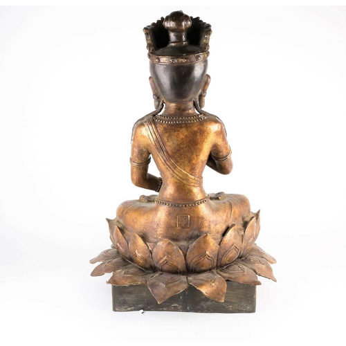 268 - A Chinese bronze figure of Avalokitesvara, 20th century, seated in mudra pose on a double lotus thro... 