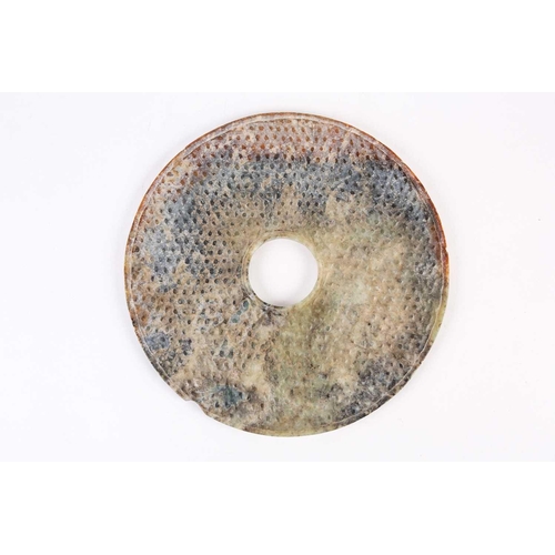 274 - A large Chinese jade Bi disc, Western Han dynasty, the stone a mix of green and brown, of typical fo... 