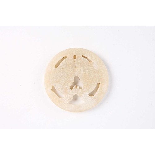 280 - A Chinese jade amulet, Warring States period, of circular form, the centre with two conjoined fish, ... 