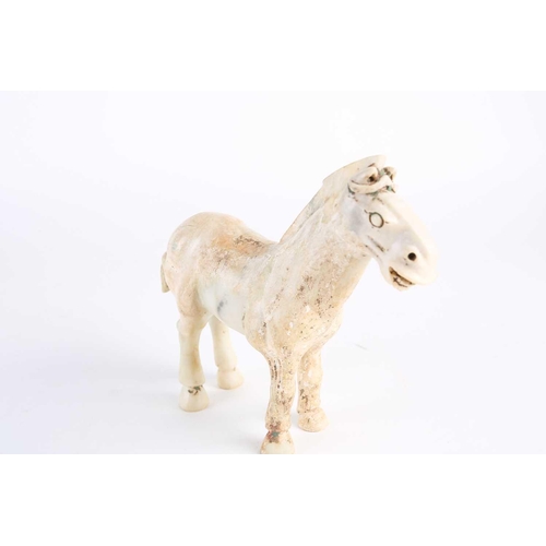 281 - A Chinese Han style white jade horse, Qing, 18th century or later, naturalistically modelled standin... 